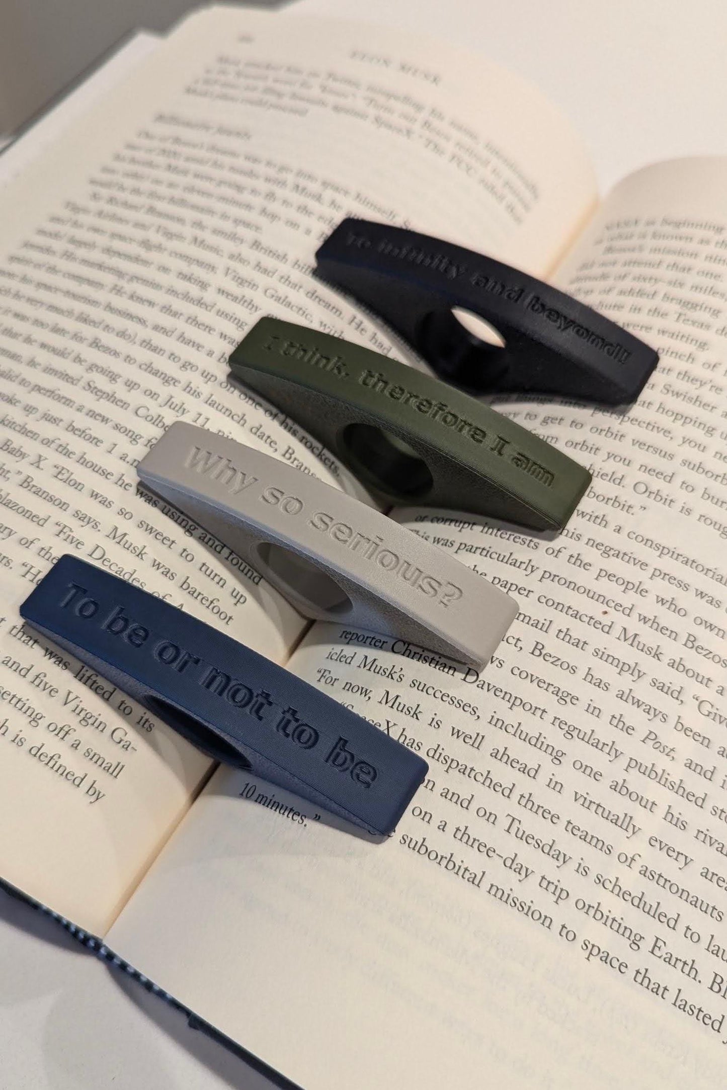 Assortment of page holders shown in multiple colors and text variations, with customizable text options for a personalized touch