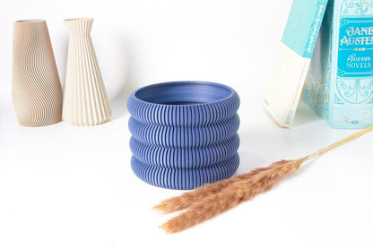 A single Aspen Ribbed Indoor Planter by EarthConcepts in Deep Sea Blue. This modern minimalist planter has a 5-inch diameter, perfect for adding style to home decor.