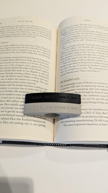 Simple, modern beige thumb page holder in plant-based material for hands-free reading. Perfect gift for book lovers and movie fans