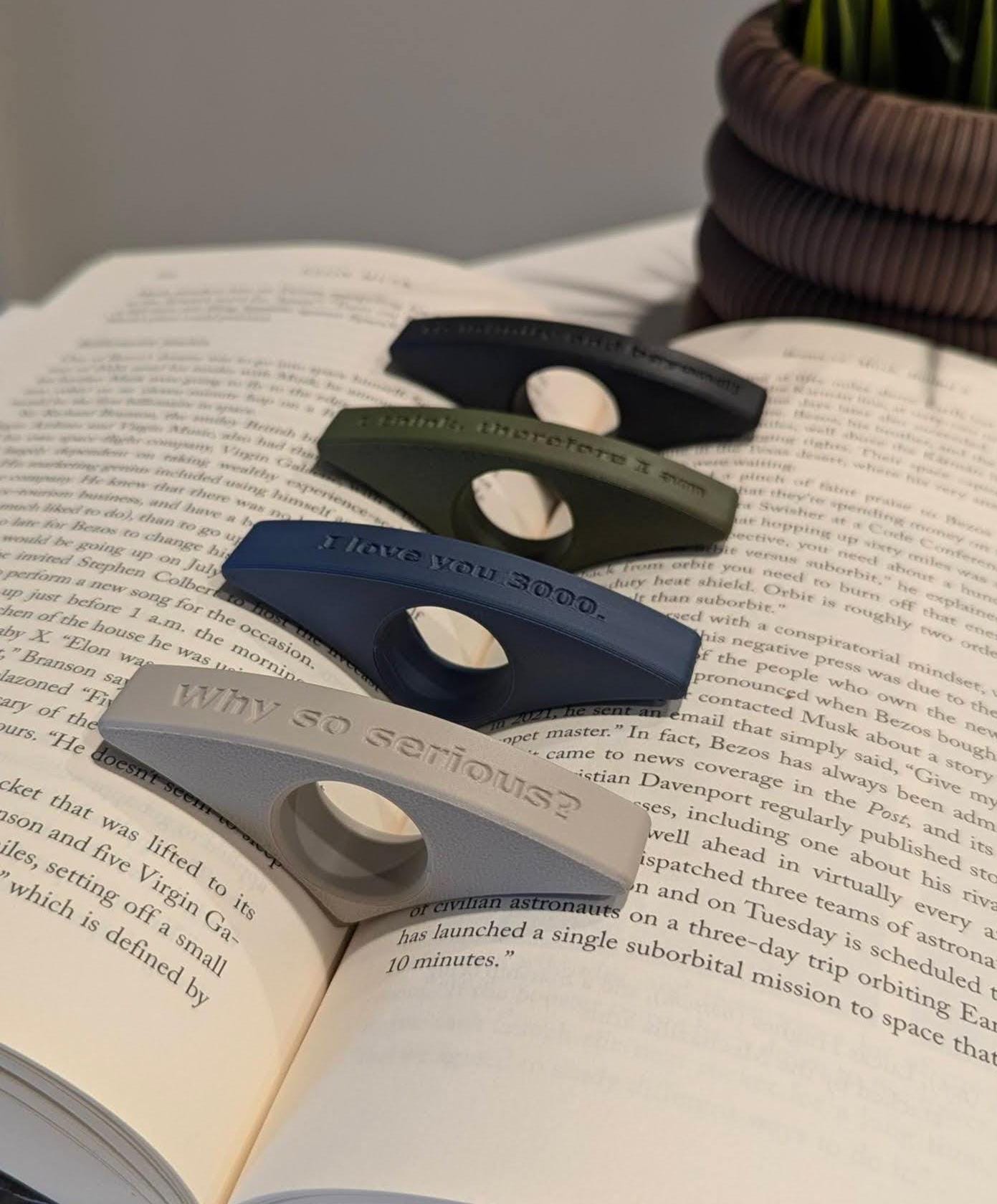 Display of page holders in a range of colors and text variations, with an option for custom text to create unique, personalized designs